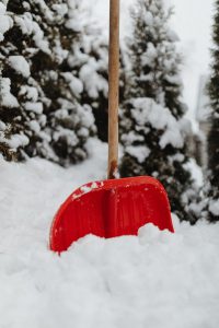 Red shovel in snow